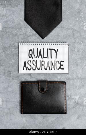 Text sign showing Quality Assurance, Concept meaning preventing mistakes and defects in manufactured products Presenting Everyday Carry Essentials, Di Stock Photo