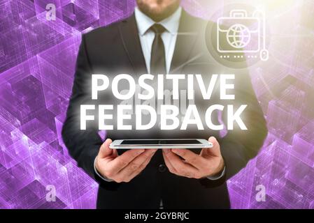Hand writing sign Positive Feedback, Word for good and great comments coming from satisfied customers Man In Office Uniform Holding Tablet Displaying Stock Photo