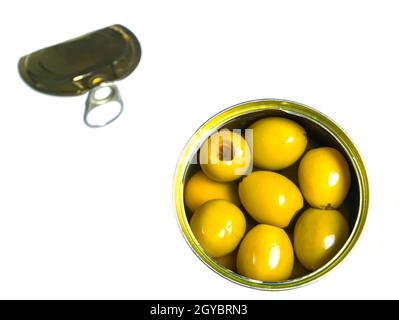 Green olives in a tin can on a white background. Green olive fruits. Olives berries. Olive fruits. Vegetables and fruits. Food photo. Canned food. Sna Stock Photo