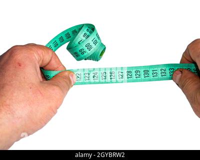 A centimeter is a tailors tool for measuring when sewing. A centimeter is a tool for measuring dimensions. A meter for sewing clothes. Tailoring for t Stock Photo
