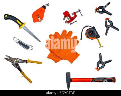 Orange gloves of a worker and a construction tool on a white background. Worker mittens. Construction tool. Renovation of apartments. Renovation in th Stock Photo