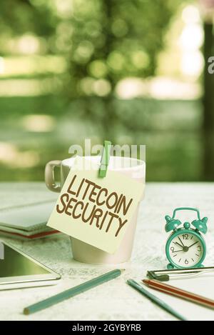 Conceptual caption Litecoin Security, Business idea peertopeer cryptocurrency and opensource software Outdoor Coffee And Refresment Shop Ideas, Cafe W Stock Photo