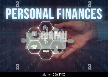 Handwriting text Personal Finances, Conceptual photo the activity of managing own money and financial decisions Hand Holding Jigsaw Puzzle Piece Unloc Stock Photo