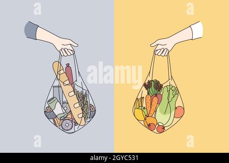 Dieting, choosing between various foods concept. Human hands holding bags of healthy vegetable vegan taw natural foods and ordinary ingredients Stock Photo