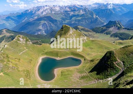 Panoramic view of the Lac du Montagnon, the famous heart-shaped lake in the Pyrenees. top view shot Stock Photo