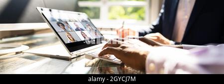 Webinar Meeting In Office Learning On Hybrid Tablet Stock Photo