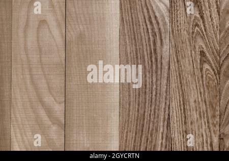 IBackground image of natural wood of two varieties with a pronounced wood structure. Top view, close-up. Stock Photo