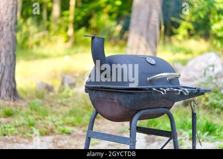 barbecue mangal with top lid in the beautofful forest background. Grilled Barbeque meat cooking process Stock Photo Alamy