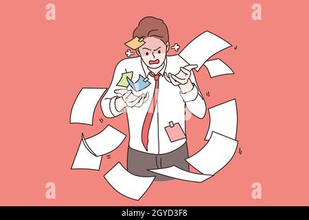 Tiredness, stress, burnout concept. Portrait of angry irritated businessman standing in flying heap of documents trying to catch feeling stressed and Stock Photo