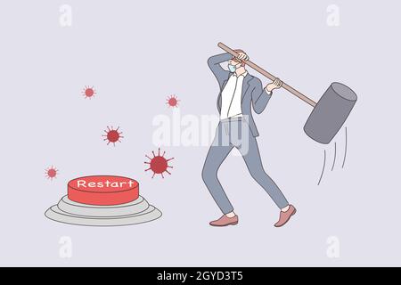 Restarting business after COVID-19 lockdown concept. Businessman in medical face mask reopening company using huge hammer to hit emergency restart but Stock Photo