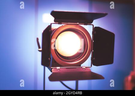 Professional studio spotlight in a TV studio. Lighting equipment for photography or videography. Stock Photo
