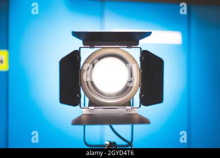 Professional studio spotlight in a TV studio. Lighting equipment for photography or videography. Stock Photo