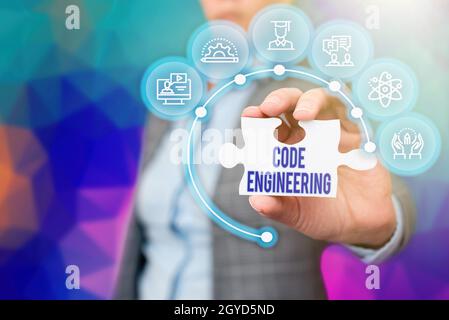 Text caption presenting Code Engineering, Concept meaning application of engineering to the development of software Business Woman Holding Jigsaw Puzz Stock Photo