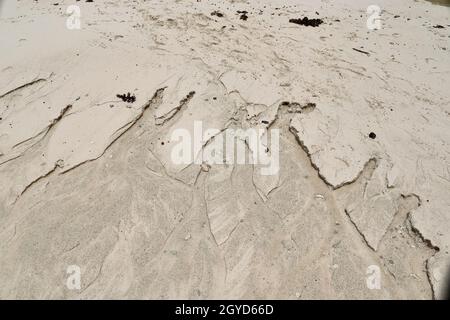 Beautiful shots of the white beach sand on the Seychelles paradise island with footprints. Stock Photo