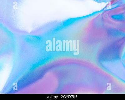 Beautiful holographic rainbow abstract background in pastel and neon color design. Real photography shot of holographic foil for creative project - de Stock Photo