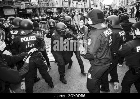 BERLIN, GERMANY - May 01, 2021: The events happening during the MayDay demonstration day in Berlin including policemen and civilians Stock Photo