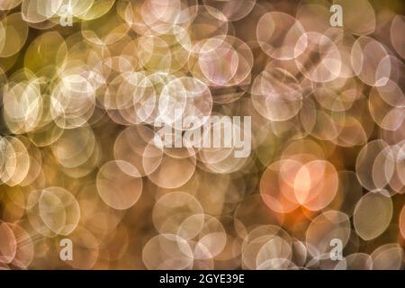Single orange bokeh dot and full frame white and green bokeh blurry pattern Stock Photo