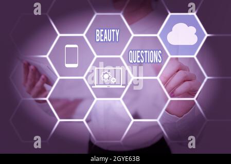 Text sign showing Beauty Questions, Business overview a sentence or phrase used to find out information Lady Holding Tablet Pressing On Virtual Button Stock Photo