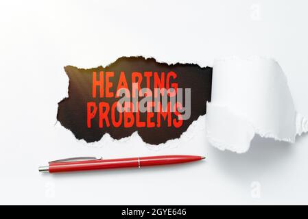 Writing displaying text Hearing Problems, Business idea partial or total inability to hear Hearing impairment Tear on sheet reveals background with pe Stock Photo