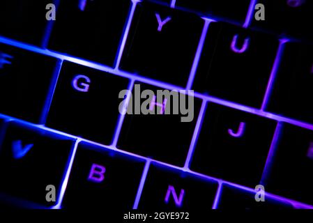 Backlit keyboard detail illuminated in the dark Stock Photo