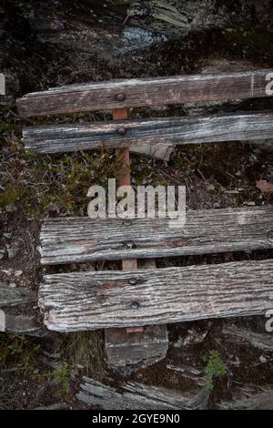 old weathered wooden bench on the Rheinsteig hiking trail near Kestert