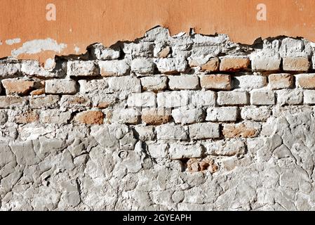 Partially damaged old brick wall texture Stock Photo