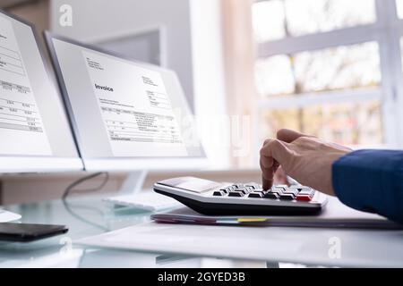 Electronic Invoice Accountant Software On Computer. Vat Tax Calculation Stock Photo