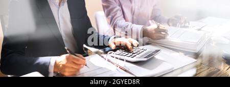 Tax Compliance And Invoice Accounting Using Calculator In Office Stock Photo