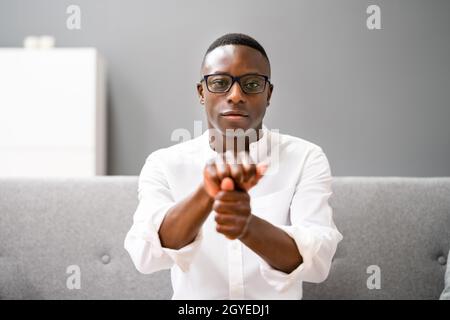 Young African Man Using Sign Language. Online Learning Call Stock Photo