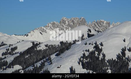 Gastlosen, snow covered mountain range near Zweisimmen. Stock Photo