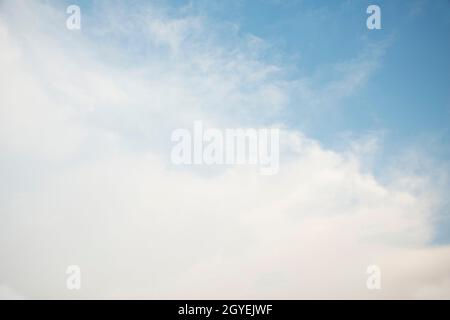 Scattered cloud clusters in a blue sky, blue sky background with white clouds, Stock Photo
