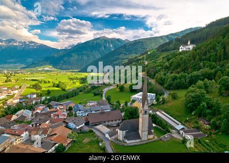 Alpine village of Burgeis and historic castles view, Trentino Alto Adige region of Italy Stock Photo