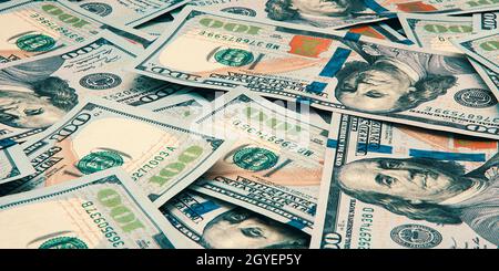 Cash hundred dollar bills, dollar background image. Scattered dollars. A big pile of dollars. Background of North American dollar bills. Color style. Stock Photo