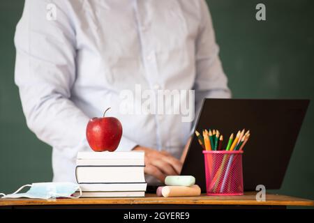 Back to School Concept. School math teacher giving virtual teaching remote class online lesson by zoom conference call on laptop computer. Stock Photo