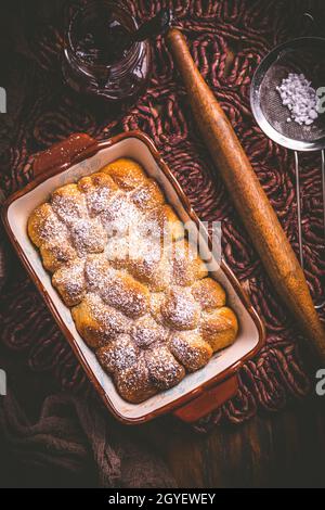 Buchteln filled with plum jam or jelly, sweet rolls with backing ingredients Stock Photo