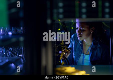 African american female computer technician working in server room Stock Photo