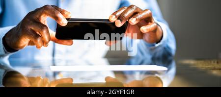 Remote Cheque Deposit Using Mobile Phone. Check Capture Stock Photo