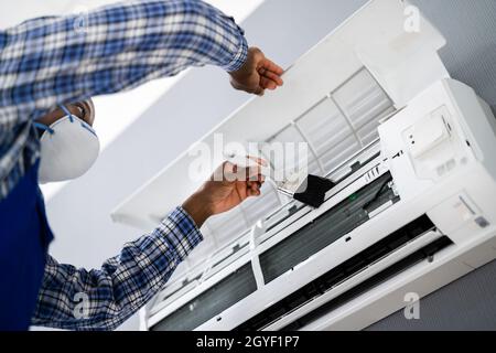 Air Conditioning Checking And Filter Cleaning. Maintenance Service Stock Photo