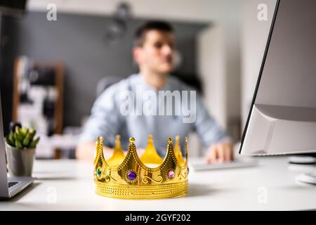 Manager Boss Man Wearing King Crown In Office Stock Photo