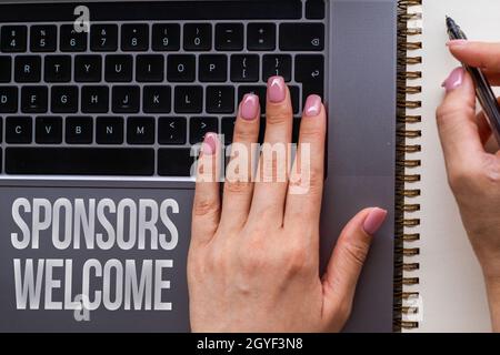 Inspiration showing sign Sponsors Welcome, Word Written on greet advertiser that supports a business or individual Hands Pointing Pressing Computer Ke Stock Photo