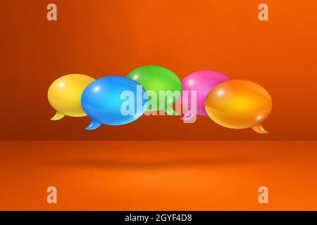 3D multicolor speech bubbles isolated on orange background Stock Photo