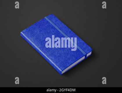 Marine blue closed notebook mockup isolated on black Stock Photo