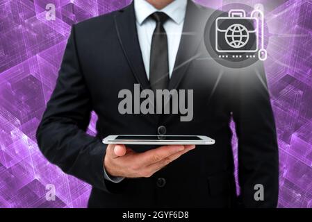 Man In Office Uniform Holding Tablet Displaying New Modern Technology. Stock Photo
