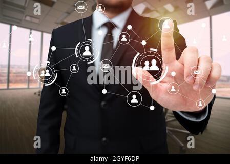 Man In Office Uniform Standing Pressing Virtual Button Holding Tablet. Stock Photo