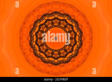 Orange polygonal kaleidoscope pattern, which consist of triangles. Geometric background in Origami style with gradient. Triangular design for your bus Stock Photo
