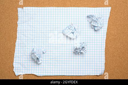 blank crumpled white sheet of paper in a cage and crumpled balls, top view Stock Photo