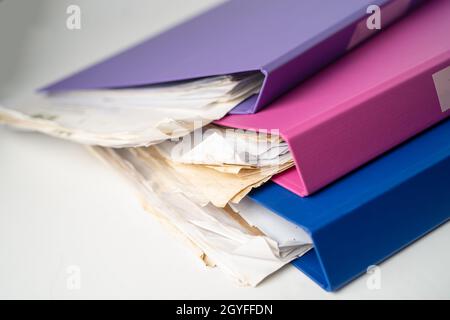 File Folder Binder stack of multi color on table in office. Stock Photo
