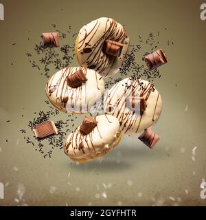 Flying donuts concept. Donuts with white chocolate glaze and chocolate Stock Photo