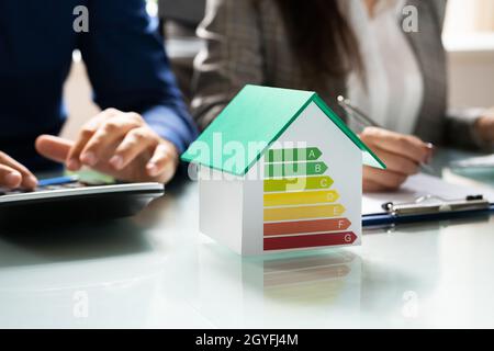 Energy Efficient House Audit Using Calculator. High Efficiency Stock Photo