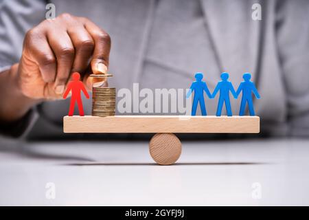 Business Candidate Imbalance Comparison And Money Leverage Stock Photo